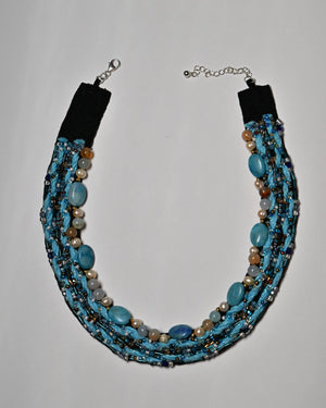 Blue sky Agate and Pearl necklace with blue yarn and seed beadwork, shown flat with an adjustable silver-filled lobster clasp.